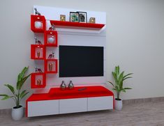 a red and white entertainment center with potted plants