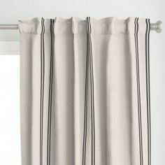 an open curtain with black and white stripes