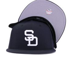 New Era Cap 59Fifty fitted hat for the San Diego Padres in navy blue colorway. Throwback logo gets the colorway from the 90s and 2000s. The result is a super-clean look that is perfect for everyday wear. With bright Snow White logo popping against the dark backdrop of the Navy wool, this is simplicity at its most perfect form. Hat Material: 100% WoolCrown: NavyVisor: NavyButton: NavyUndervisor: GreyFront Logo: Snow WhiteNew Era Flag: Midnight NavyRear Logo: Midnight Navy/Snow White/Light Navy Throwback Baseball Cap For Baseball Season, Throwback Snapback Fitted Hat For Baseball Season, Baseball Season Fitted Hat With Letter Patch, Navy Fitted Hat For Baseball Season Streetwear, Navy Flat Bill Hat For Baseball Season, Classic Snapback Fitted Hat For Fan Gear, Classic Snapback Fitted Hat For Fans, Fitted Hat With Letter Patch For Baseball Season Streetwear, Navy Fitted Hat With Flat Brim For Baseball Season