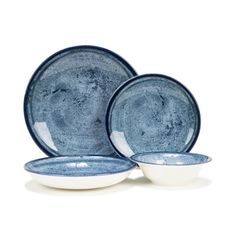 three blue and white dishes on a white background