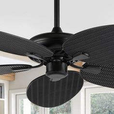 a black ceiling fan in a room