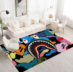 a living room with white furniture and a colorful rug on the floor that looks like a shark