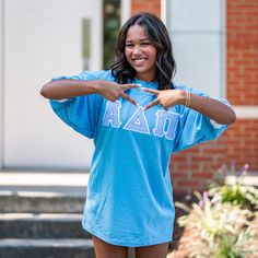 This unique & trendy Blue Seersucker Greek Letter Sorority Chapter Unisex Crew Neck Jersey Bid Day T-Shirt is sure to stand out on any campus!  Grab one for you, your favorite sister, or a group of sisters (chapter discounts offered - see below for more information). Pictures Featuring: ⭑ #1-4: Columbia Blue Shirt (White cuff trim), White background fabric (Alpha Delta Pi)  There are 5 parts to your Greek Letter Shirt: 1. T-shirt Color 2. T-shirt Size 3. T-shirt Trim Color (Cuff around the sleeve)  4. Background Fabric Letter Color - This is the fabric behind the printed fabric. Each greek letter shirt is double stitched (two layers of fabric)  5. Greek Organization  - MAX 3 Greek letters  *please refer to the Greek Letter Shirt Info diagram for directions if you are confused* Please inclu Blue Spring Tops With School Spirit Style, Blue Tops For Spring School Spirit, Blue Spring Tops For School Spirit, Sorority Cotton T-shirt For Spring, Sorority Style Cotton T-shirt For Spring, Spring Sorority Cotton T-shirt, Collegiate Short Sleeve Tops For Spring, Short Sleeve Sorority Tops For Spring, Sorority Short Sleeve Tops For Spring