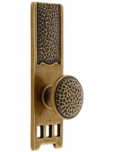 a door handle with an animal print pattern on the front and back side, is shown