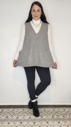 Details: Don't you love a good neutral? This tunic heather grey vest is a soft and comfortable material. It is lightweight, flowy, and oversized. It has some contrast ribbed detailing on the hem, neckline, and arm holes. It features two pockets. It is a fantastic length for coverage. It looks good with jeans or leggings and boots or sneakers! (Top Sold Separate) Materials: 57% Acrylic, 20% Nylon, 3% Spandex Made In: China Sizing Tip: You can order true to size. Size down if inbetween. S & M get Fall Ribbed Vest For Layering, Ribbed Vest For Winter Layering, Oversized Sweater Vest For Spring Layering, Casual Sweater Vest For Fall Loungewear, Cozy Gray Tops For Workwear, Cozy Gray Top For Workwear, Gray Stretch Vest For Spring, Casual Stretch Sweater Vest For Layering, Relaxed Fit Sweater Vest For Fall Layering