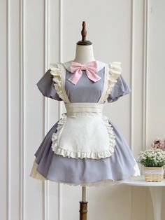 This price includes a dress and a pink bowknot.  Get ready to channel your inner maid with this stunning Dark Blue Lolita Fashion Apron Dress. Complete with a charming bowknot on the neckline, this dress is perfect for anyone looking to add a touch of elegance and whimsy to their wardrobe. Whether you're attending a tea party or simply want to showcase your love for Lolita fashion, this apron dress is sure to turn heads and make you feel like a true fashionista.   	 		 			Size 			S 			M 			L Cute Maid Dress, Fashion Apron, Steampunk Fashion Male, Gothic Skirts, Chubby Fashion, Pink Lotus, Doll Ideas, Maid Dress, Apron Dress