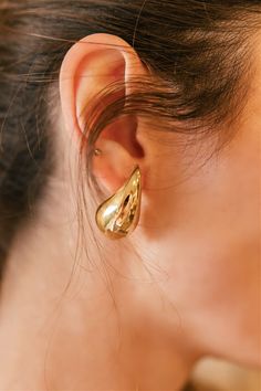 Add some glam to your earring collection with our Gold Drop Earrings! Lightweight on the ear and a fun twist on the classic gold hoop, a perfect statement piece. They are great for everyday wear, wedding, festival, or enjoying a GNO! Non-tarnish, water resistant. Made in Italy. Lightweight 1/2" wide x 1" long Elegant Huggie Earrings For Party, Elegant Gold Huggie Earrings For Party, Party Earrings In 14k Yellow Gold, 14k Yellow Gold Earrings For Party, Yellow Gold 14k Earrings For Party, Elegant Yellow Gold Wrap Earrings For Party, Yellow Gold 14k Party Earrings, Gold Plated Yellow Gold Hoop Earrings For Party, Yellow Gold Plated Hoop Earrings For Party