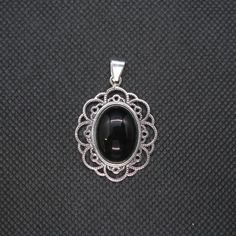 Brand new sterling silver pendant with 18x13mm black onyx - PE001454. Stamped 925. Approximate weight 7.0 grams. Dimensions 29x25mm (1.16x1.00 inches). All our jewels are made from solid sterling silver 925/1000 and are carefully crafted by hand in our family workshop. We dispatch your orders in 5 working days, worldwide and the postage is $5. We ship registered priority mail. Please allow 5-7 working days for delivery in Europe and 10-15 working days outside Europe. For any questions - please d Classic Black Oval Pendant Jewelry, Black Engraved Oval Pendant Jewelry, Black Oval Engraved Jewelry, Oval Black Engraved Jewelry, Black 925 Stamped Pendant Jewelry, Black Sterling Silver Jewelry With Oval Cabochon, Black Oval Cabochon Sterling Silver Jewelry, Black Round Pendant Jewelry With Cabochon, Black Cabochon Round Pendant Jewelry