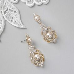 Elegant Pearl Earrings For Wedding, Elegant Pearl Bridal Earrings With Intricate Design, Elegant Pearl Embellished Chandelier Earrings For Wedding, Elegant Wedding Chandelier Earrings, Elegant Pearl Earrings With Intricate Design, Elegant White Bridal Earrings With Intricate Design, Elegant Pearl White Chandelier Earrings, Elegant Pearl White Chandelier Earrings For Wedding, Elegant Crystal Bridal Earrings For Mother Of The Bride