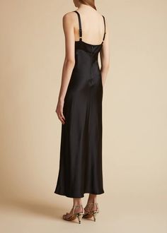 The Joely Dress in Black– KHAITE Chic Evening Slip Dress With Built-in Bra, Elegant Evening Slip Dress With Built-in Bra, Chic Slip Dress With Built-in Bra And Fitted Bodice, Evening Fitted Slip Dress With Adjustable Straps, Elegant Fitted Slip Dress With Straps, Fitted Slip Dress With Back Opening For Date Night, Evening Suspender Dress With Spaghetti Straps And Fitted Bodice, Fitted Evening Slip Dress With Adjustable Straps, Sleek Fitted Slip Dress With Back Opening