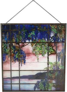 a stained glass window with vines hanging from it