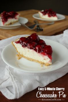 a slice of cheesecake with cherries on top