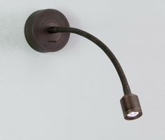 an image of a wall light that is on the side of the wall with a cord attached to it