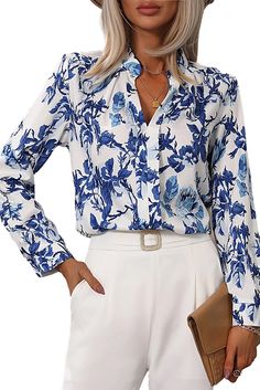 Elevate your style with our Saffi Floral Print Notched V-Neck Blouse. Perfect for any occasion, the delicate floral print adds a touch of femininity while the notched v-neck creates a flattering neckline. Expertly crafted for comfort and versatility, this blouse will become a staple in your wardrobe. Model Info: Models are 5'7", Size 2, wearing smalls Material: 100% Polyester Size Chart (INCH) Sizes Bust Hem_Width Shoulder Sleeve_Length Length Relax Relax Relax Relax Back S 39.0 41.7 15.2 23.2 2 Feminine V-neck Printed Blouse, Spring Floral Print Top With Split Neck, Spring Floral Print Split Neck Top, Chic Floral Print Top With Split Neck, Feminine Floral Print Top With Split Neck, Blue Floral Print V-neck Blouse, Spring Floral Print V-neck Blouse, Spring Printed Split Neck Blouse, Spring Printed Blouse With Split Neck