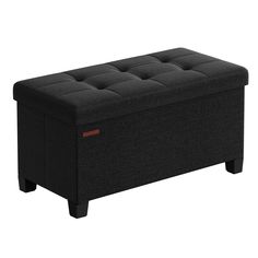 a black storage bench with buttons on the top and bottom section, in front of a white background