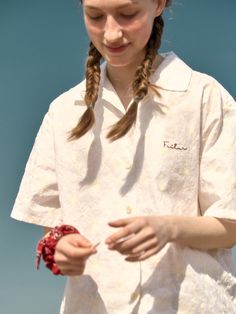 This product, the Sea Embroidery Shirt, captures a relaxed, beach-inspired aesthetic perfect for casual wear. The shirt features subtle embroidery that adds a touch of personality to the overall design. It is tailored for comfort with a loose fit, making it ideal for warm weather or a laid-back day by the sea. - This Sea Embroidery Shirt is adorned with delicate sea-themed embroidery on the front, adding a unique detail.- The short sleeves and lightweight fabric ensure comfort and breathability during hot weather.- Its loose, relaxed fit makes it perfect for casual outings and beach trips, offering both style and ease.- The shirt also features a classic button-up front and a soft collar, enhancing its versatile and timeless appeal. Relaxed Fit Floral Embroidery Shirt For Vacation, Floral Embroidered Collared Shirt For Vacation, Summer Floral Embroidery Relaxed Fit Shirt, Summer Floral Embroidered Relaxed Fit Shirt, Beach Embroidered Collared Shirt, Summer Embroidered Relaxed Fit Shirt, Summer Floral Embroidered Collared Shirt, Embroidered Relaxed Fit Shirt For Summer, Embroidered Collared Beach Top