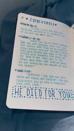 an open book with blue writing on it that reads, he died for you and the words