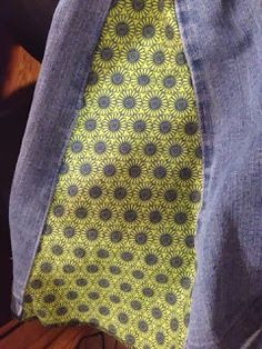 a person wearing jeans and a tie with an interesting design on it's neck