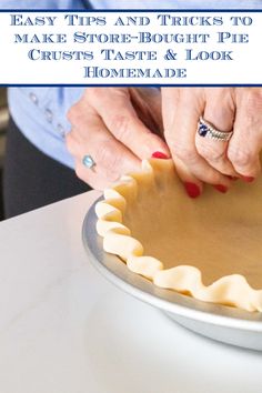 a woman is decorating a pie with icing on the top and bottom layer