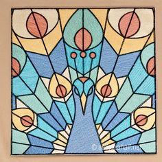 a stained glass window with a blue bird on it