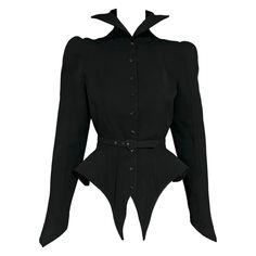 Thierry Mugler extremely rare collectible dramatic black belted jacket from the iconic Fall Winter "Les Infernales” 1988 collection and as seen on the runway. Peplum flared waist that is elongated and pointy in the front and joins together at a point in the back Constructed with striped seaming throughout. Snap button closure Vampire-esque standing collar. Rounded puffy style shape at the shoulders Unique jagged shaped belt buckle Shoulder pads Pointed cuffs Made in France Size: FR38 Condition: Fitted Evening Outerwear With Belted Cuffs, Fitted Belted Evening Outerwear, Fitted Belted Outerwear For Evening, Mugler Spring 1997 Couture, Structure Clothing, Mugler Black, Alt Outfits, Peplum Jacket, Thierry Mugler