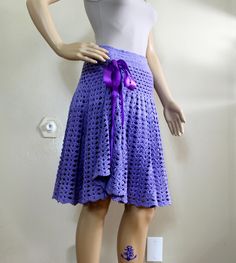 "Crocheted Skirt Heirloom Quality American Retro BoHo Chic Hand Crocheted Lavender Purple Lined Skirt Cotton S Designer by Annie Briggs May also be worn as a tunic https://www.etsy.com/listing/1288521865/crochet-tunic-top-heirloom-quality Materials: 50% Cotton 50% acrylic 100% polyester (Ribbon)  100% Polyester (Lining) This yarn has a nice drape. The yarn is spun loosely which leads me to believe the cotton is a long staple cotton i.e. Egyptian cotton, which gives it that property. The yarn is made in Turkey.  Dry clean for the professional pressing. You'll want flat stitches for their figure slenderizing effect.   Please store in the resealable bags included. Tissue is acid free. All work is done is my pet free, smoke free home. Size US/2/S Measurements laying flat: Waist stretches 22\" Purple Asymmetrical Skirt For Spring, Lavender Fitted Skirt, Fitted Long Purple Skirt, Fitted Lavender Lined Skirt, Purple Fitted Long Skirt, Fitted Lined Lavender Skirt, Purple Asymmetrical Skirt For Summer, Spring Festival Crochet Trim Skirt, Fitted Asymmetrical Purple Skirt