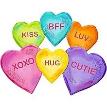 six heart shaped candys with the words kiss, hug, luv, hugs