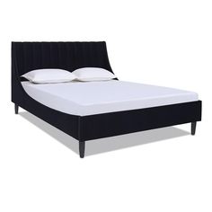 a black bed frame with white pillows on top of it and an upholstered headboard