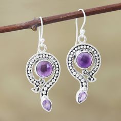 These beautiful dangle earrings are presented by Shanker of India. Expertly crafted by hand, a stunning sterling silver motif encircles a checkerboard-faceted amethyst. Petite dots of silver decorate the middle of the motif, which is reminiscent of a question mark. A faceted pear-shaped amethyst sparkles brightly from the end, completing the uniquely elegant design. The gemstones total over six carats. A Question Mark, Amethyst Color, Amethyst Earrings, Question Mark, Artisan Craft, Hook Earrings, Pear Shaped, Elegant Design, Jewelry Earrings Dangle