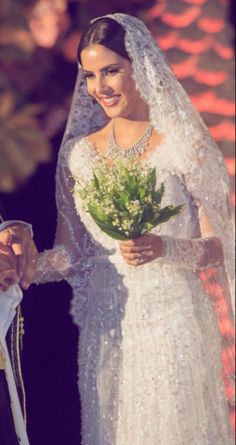 the bride and groom are smiling at each other