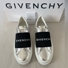 These Givenchy Sneakers Feature A Metallic Leather Upper With An Elastic Logo Strap Across The Vamp. Leather Upper Round Toe Slip-On Style Rubber Sole Made In Portugal Size 36.5 New In Box With Dust Bag And Care Card. 100% Authentic. Retail: 695. Silver Low-top Sneakers With Metallic Logo, Modern Silver Sneakers With Metallic Logo, Modern Silver Sneakers With Rubber Sole, Luxury Silver Sneakers With Rubber Sole, Metallic Silver Leather Sneakers With Round Toe, Silver Low-top Metallic Leather Sneakers, Silver Metallic Leather Low-top Sneakers, Silver Metallic Leather Sneakers With Round Toe, Luxury Silver Leather Sneakers