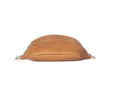 Step up your game with THE Bum Bag by Tottie. The tan with gold hardware bum bag is just the right size to keep your essentials organised and your hands free while on the go.Minimalist in tan with a luxe vibe, her clever design with the practicality every woman wants, but doesn't know exists, makes her irresistible. She’s crafted of vegan leather, with an adjustable strap that allows you to wear it cinched at the waist, across the body, or over the shoulder. Designed by women, for women who don't want to sacrifice style for practicality and efficiency.She’s thought of everything, a wide opening main zip compartment, gold hardware, and a front zip pocket to stash all the knick-knacks and whatnot! Our bum bag doesn't look like a typical bum bag, and she is as ideal for a day out, as she is f Belt Bag For Women, The Knick, Tan Belt, The Wing, Water Design, Bum Bag, Clever Design, Knick Knacks, Bag For Women