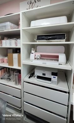 a sewing machine sitting on top of a white shelf next to other crafting supplies