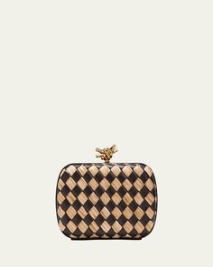 Bottega Veneta minaudière bag in intrecciato leather and raffia     Structured top with knot liftclasp closure     Approx. 5"H x 7.5"W x 2"D    Made in Italy Rectangular Woven Leather Evening Clutch, Evening Rectangular Woven Leather Clutch, Rectangular Clutch With Intrecciato Weave For Evening, Evening Clutch With Intrecciato Weave, Luxury Woven Leather Rectangular Clutch, Luxury Rectangular Woven Leather Clutch, Rectangular Intrecciato Weave Clutch For Evening, Chic Rectangular Intrecciato Clutch, Designer Woven Leather Clutch For Evening