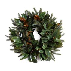 a wreath with green leaves and brown ribbons