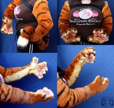 the woman is dressed as a tiger and has her hands in her pockets with one paw raised up