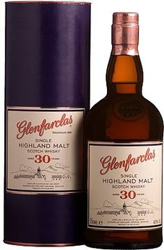 a bottle of highland 30 year old whisky next to a purple box on a white background