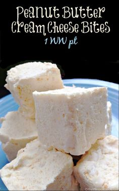 several pieces of white fudge sitting on top of a blue plate