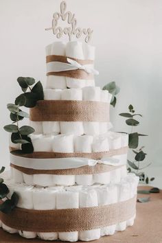 a wedding cake made out of diapers and burlocks