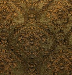 an intricately designed wallpaper in gold and brown