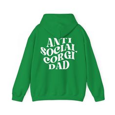 a green hoodie with the words anti social corgi dad printed on it