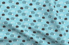 a blue background with black and white polka dot designs on it, including an elephant