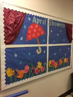 a bulletin board with flowers and umbrellas on it