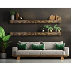 a living room with two wooden shelves and green pillows on the couch in front of it