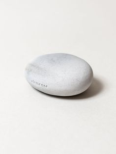 a white rock sitting on top of a table