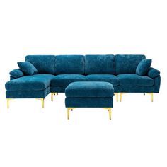 a blue couch and ottoman sitting next to each other