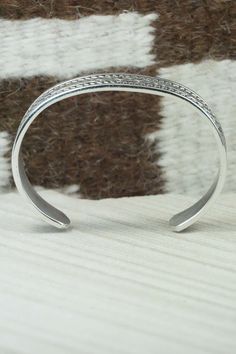 This sterling silver and bracelet was made by Navajo silversmith Bruce Morgan. The inside is signed B. Morgan and stamped sterling.Size: 5 1/4" (will fit up to a 6 3/8" wrist)Gap: 1 1/8"Width: 1/2"Free shipping on all orders! We ship with USPS and always include tracking. All orders ship within a day of payment.Returns are accepted up to 30 days after you receive your order. Just send us a message. Our shop offers cash back or store credit. The item must be returned in new condition. Sterling Silver Bracelet, Native American Jewelry, Free Jewelry, Sterling Silver Bracelets, Silver Bracelet, Gap, Bracelet, Sterling Silver, Free Shipping