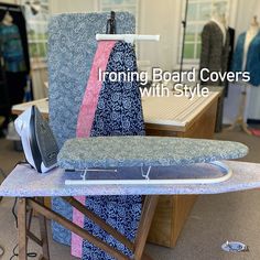 ironing board covers with style on display in shop area, including an ironing board and clothes hanger