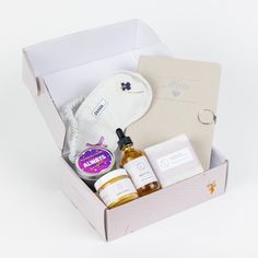 an open box containing skin care products on a white background with the contents in it