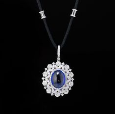 A stunning 22.12 carat natural Tanzanite Cabochon pendant, adorned with diamonds - all set in 18K solid white gold. The centre stone is absolutely clean, with no inclusions and great luster.  Tanzanite oval: 22.12 Ctw Diamond round: 5.86 Ctw Gold White: 20.91 grams Luxury Silver Tanzanite Necklace, Luxury Tanzanite Necklace With Brilliant Cut, Diamond Cabochon Pendant Necklace, Luxury Oval Cabochon Necklace, Luxury Oval Tanzanite Necklaces, Luxury Sapphire Oval Pendant Necklace, Natural Tanzanite, Cabochon Pendant, Diamond Pendant Necklace